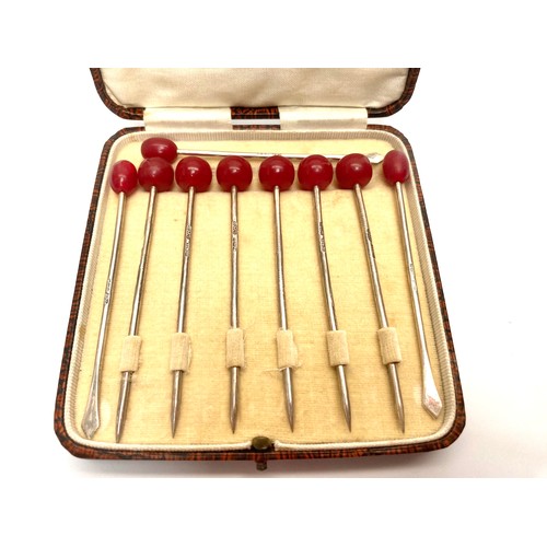 851 - Set of six  cased cherry sterling silver cocktail sticks, and three bean  sterling silver sticks. Bi... 