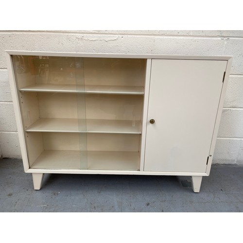 1100 - Cream book case.