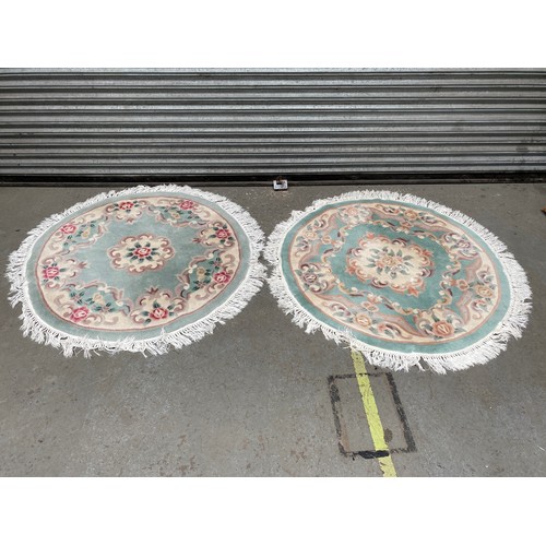 138 - 2 green round rugs. diameters: 4ft.