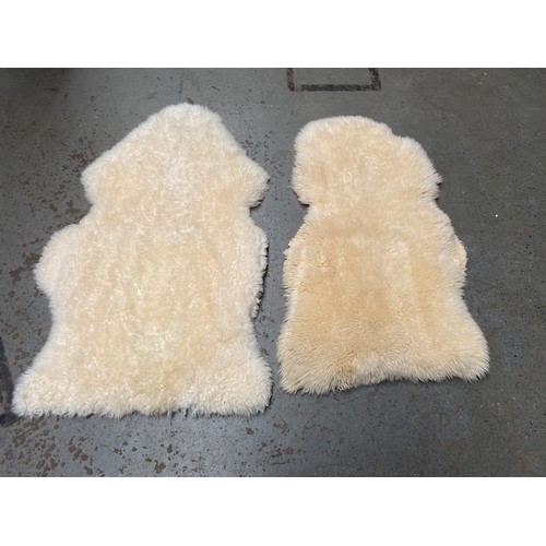 1122 - 2 vintage sheep skin rugs.