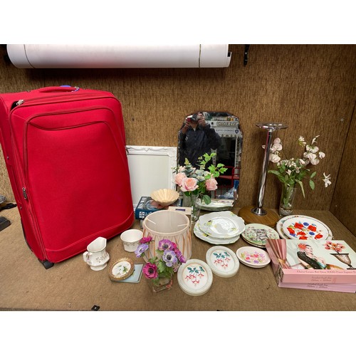 161 - Large red suitcase and household items.