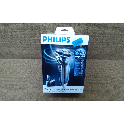 1142 - Boxed new Philips Arcitec RQ1095 razor with docking station.