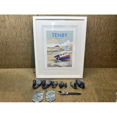 210 - Tenby poster in a frame and a collection of canadian doma carved duck.