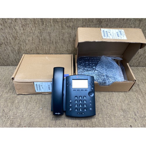 487 - 2 new telephones made by Polycom. Serial number VVX301.