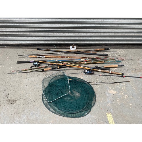 221 - Selection of fishing rods and a keep net.