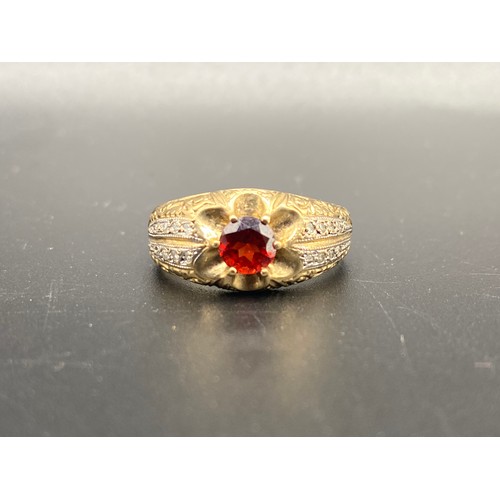 898 - Stunning 9ct gold ring with Diamond shoulder stones and red stone. 4.3g Size Y.