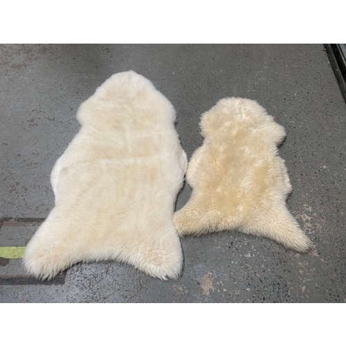 1121 - 2 vintage sheep skin rugs.