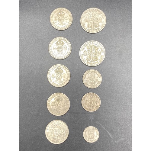 919 - 10 Half silver British coins including Half Crowns and two shillings. 99g.