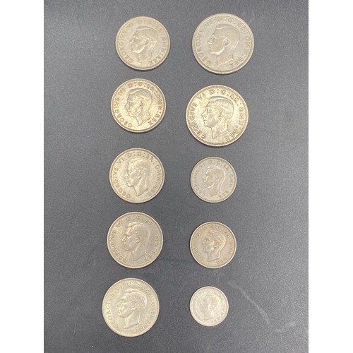 919 - 10 Half silver British coins including Half Crowns and two shillings. 99g.