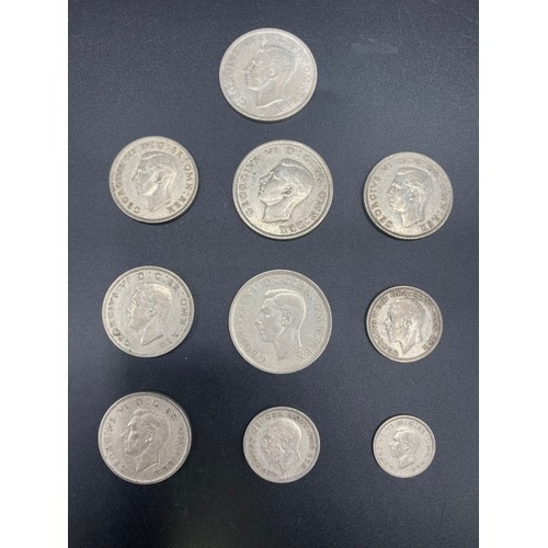 920 - 10 Half silver British coins including Half Crowns and two shillings. 101g.