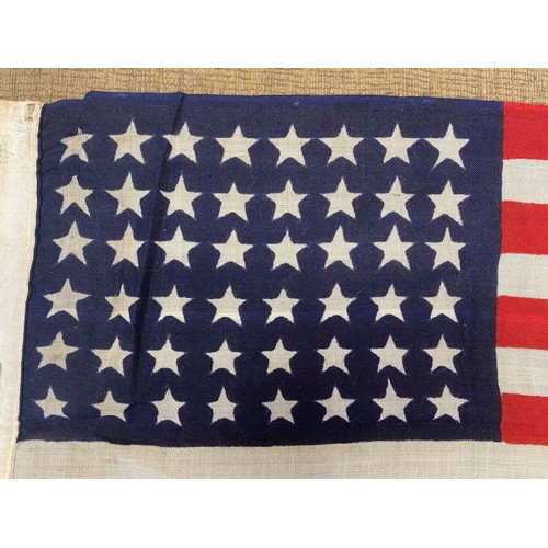 751 - 48-star, American stars and stripes flag. Cloth flag woven cloth and showing signs of age. Markings ... 