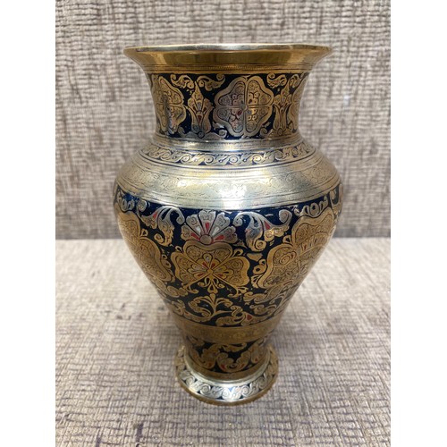 762 - Carved brass vase; 20cm tall.