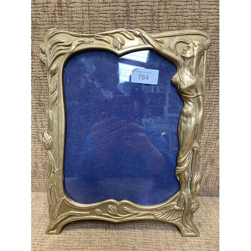 764 - Large brass art nouveau photo frame; 30cm x 24cm.