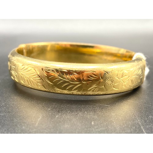 929 - Vintage rolled gold slide open bangle with engraving.