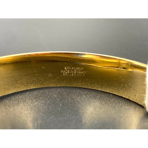 929 - Vintage rolled gold slide open bangle with engraving.