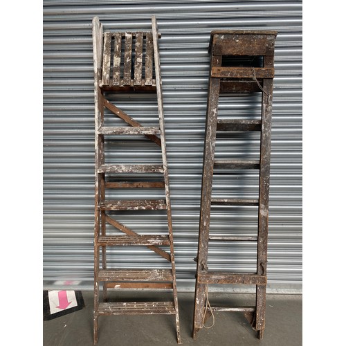 233 - 2 sets of wooden ladders.