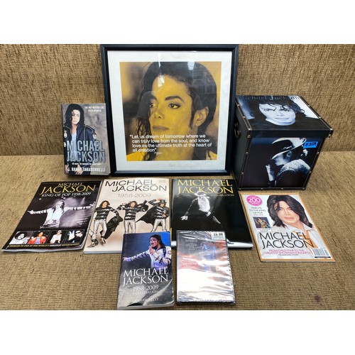 1135A - Box containing Michael Jackson memorabilia including: Books and CDs.