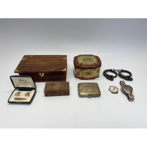 1251 - Collectibles including a naval book shaped box and children's metal handcuffs.