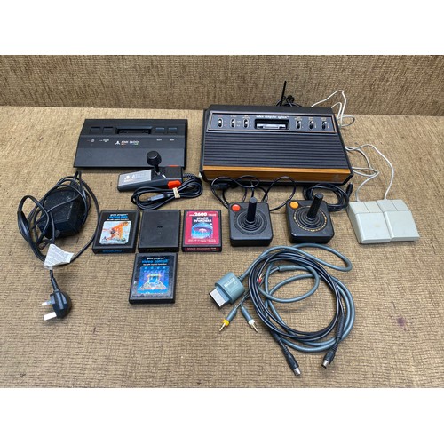 1255 - Atari; model number: 0X2600, Atari 2600, controllers and games.