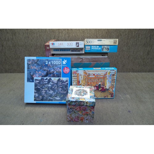 292 - Large amount of boxed jigsaw puzzles