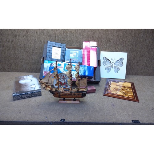 299 - Miscellaneous items including HMS victory on a wooden plinth and a marquetry plaque