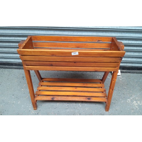 317 - Wooden planter. 65x56