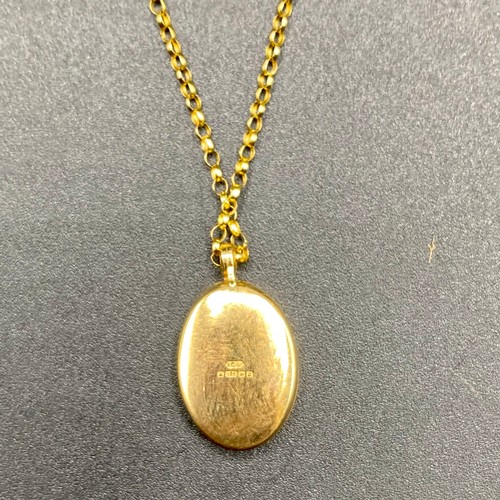 857 - 9ct gold locket and chain. 2.3g