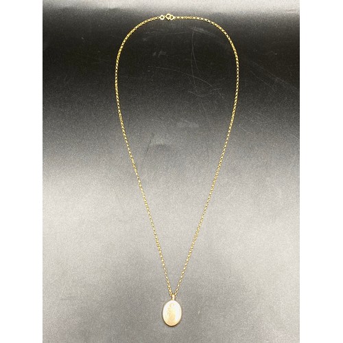 857 - 9ct gold locket and chain. 2.3g