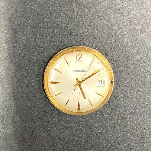 866 - Garrard 9ct gold automatic watch (running missing winder).