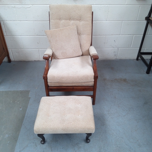 140 - Modern wooden framed arm chair with foot stool