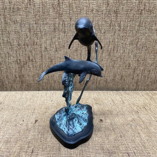 682 - Bronzed dolphins; 30cm tall.