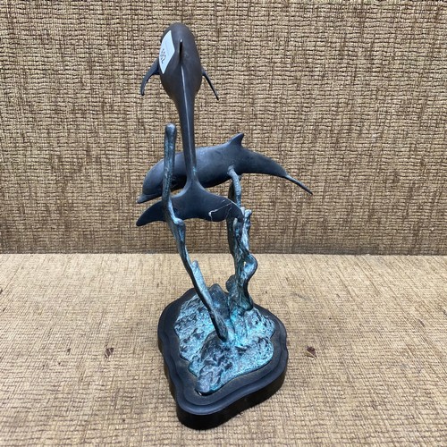 682 - Bronzed dolphins; 30cm tall.