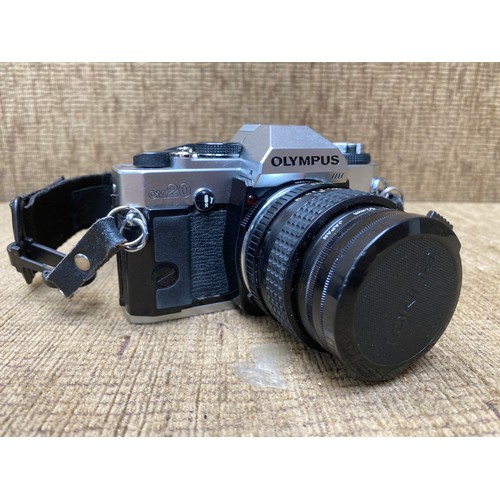 692 - Vintage and collectible Olympus OM20 camera, a Sigma skylight 210mm ZOOM-K II lens and a padded carr... 