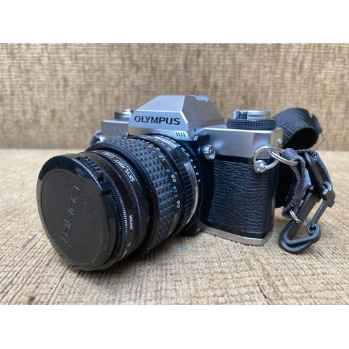 692 - Vintage and collectible Olympus OM20 camera, a Sigma skylight 210mm ZOOM-K II lens and a padded carr... 