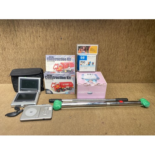 102 - Selection of mixed items including: Compact printer, selphy stick and in car dvd player and screen.