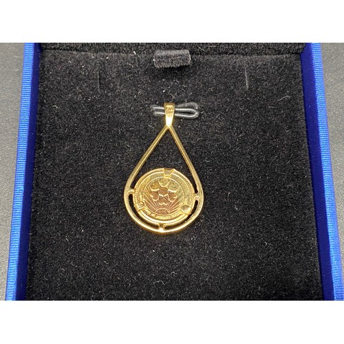 914 - Gold dove of peace coin mounted in a pendant 2.7g (hallmarks and tests as high quality gold).