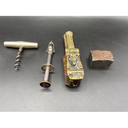 730 - Swedish olive/cherry picker, brass nut cracker, 17th century stamp block and foldaway corkscrew.