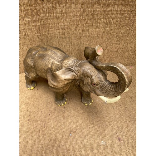 1125 - a large resin elephant 48cm high one tusk slightly damaged