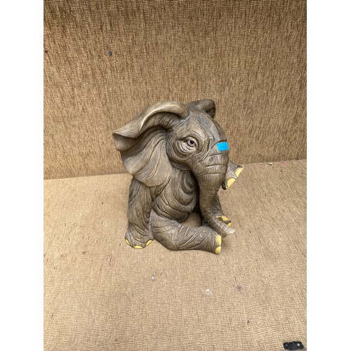 1126 - A large resin sitting elephant