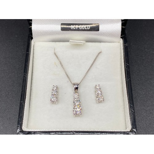 945 - Stunning 9ct white gold necklace with diamond pendant and matching white gold diamond earrings.