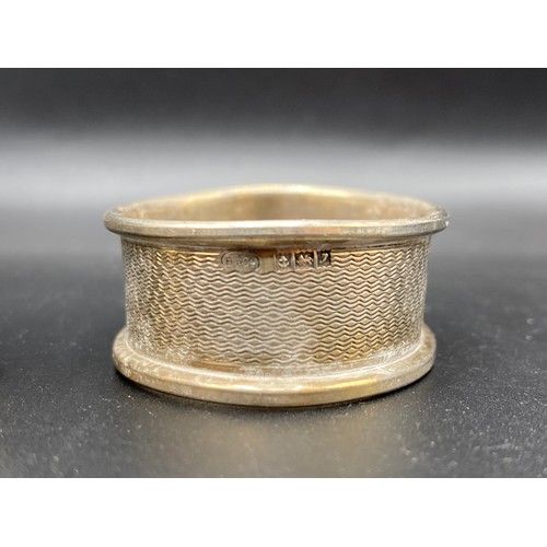 949 - Two sterling silver napkin rings. 37g.