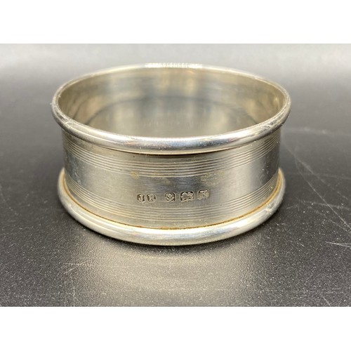 950 - Two sterling silver napkin rings. 23g.