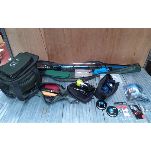 576 - Two sea fishing rods, two reels and an assortment of tackle