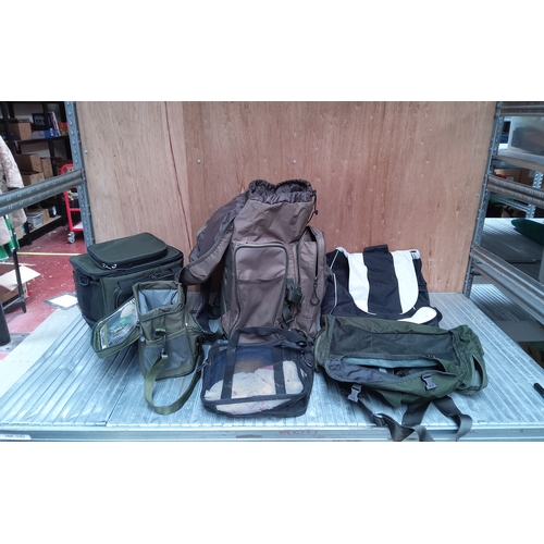 587 - A selection of fishing bags including a rucksack