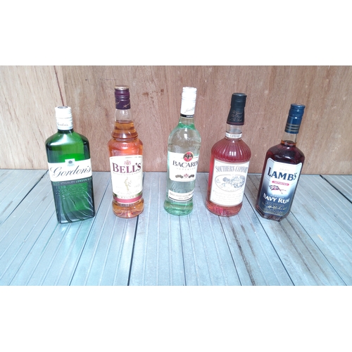 196 - Five bottles of alcohol including whiskey, gin, bacardi, Southern Comfort and navy rum