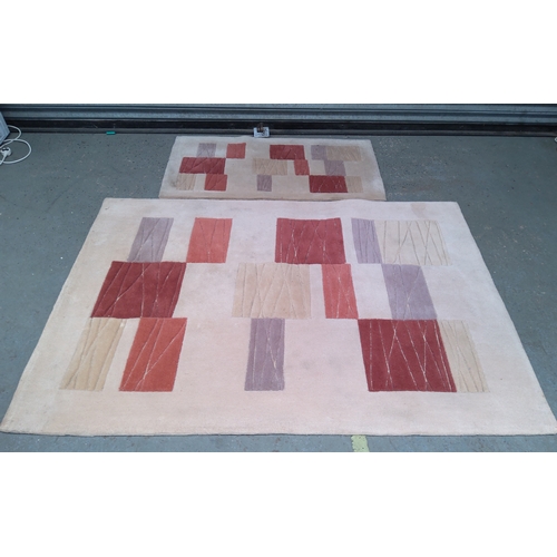 236 - Two handcrafted rugs large one is 180cm x 120cm