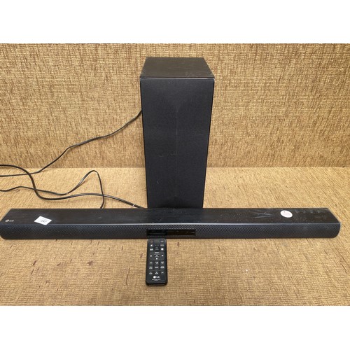 247 - LG sound bar with remote and an LG subwoofer.