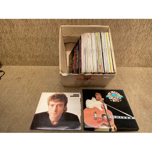 256 - Collection of vinyl records including: John Lennon and ELvis.