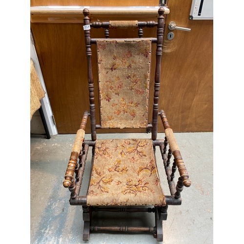 135A - Mid-century American oak rocking chair.