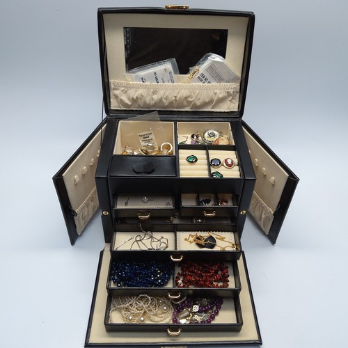 464 - Faux leather jewellery box with contents including some silver